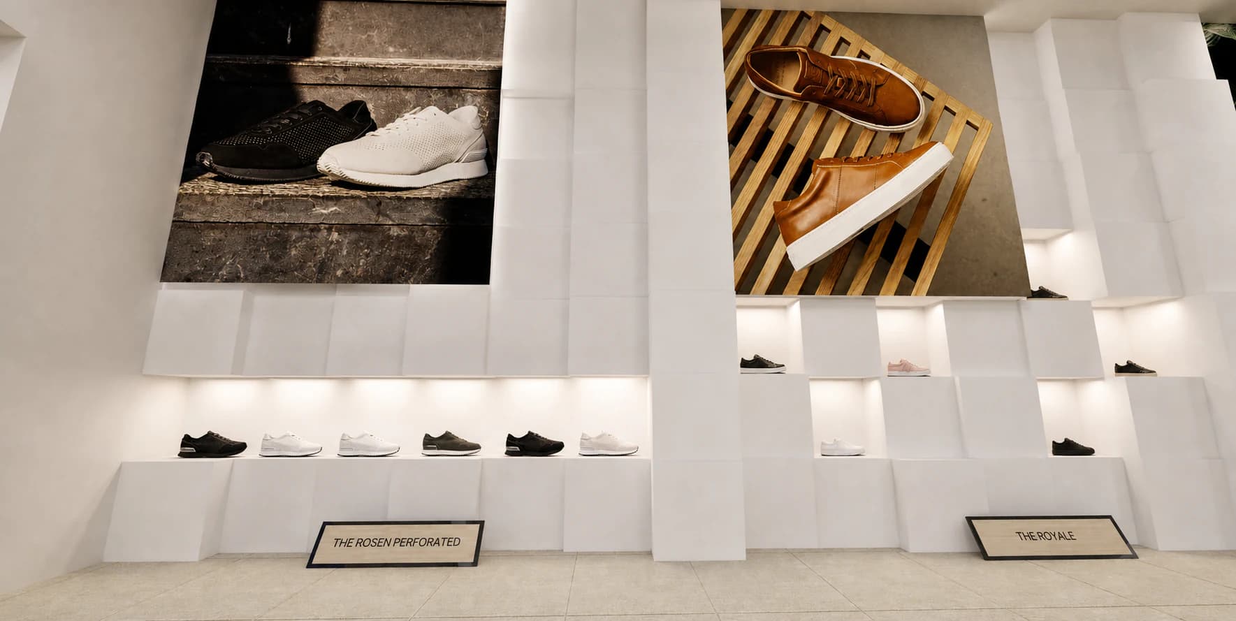 Illuminated modular shoe wall and oversized footwear campaign images in the Greats store.
