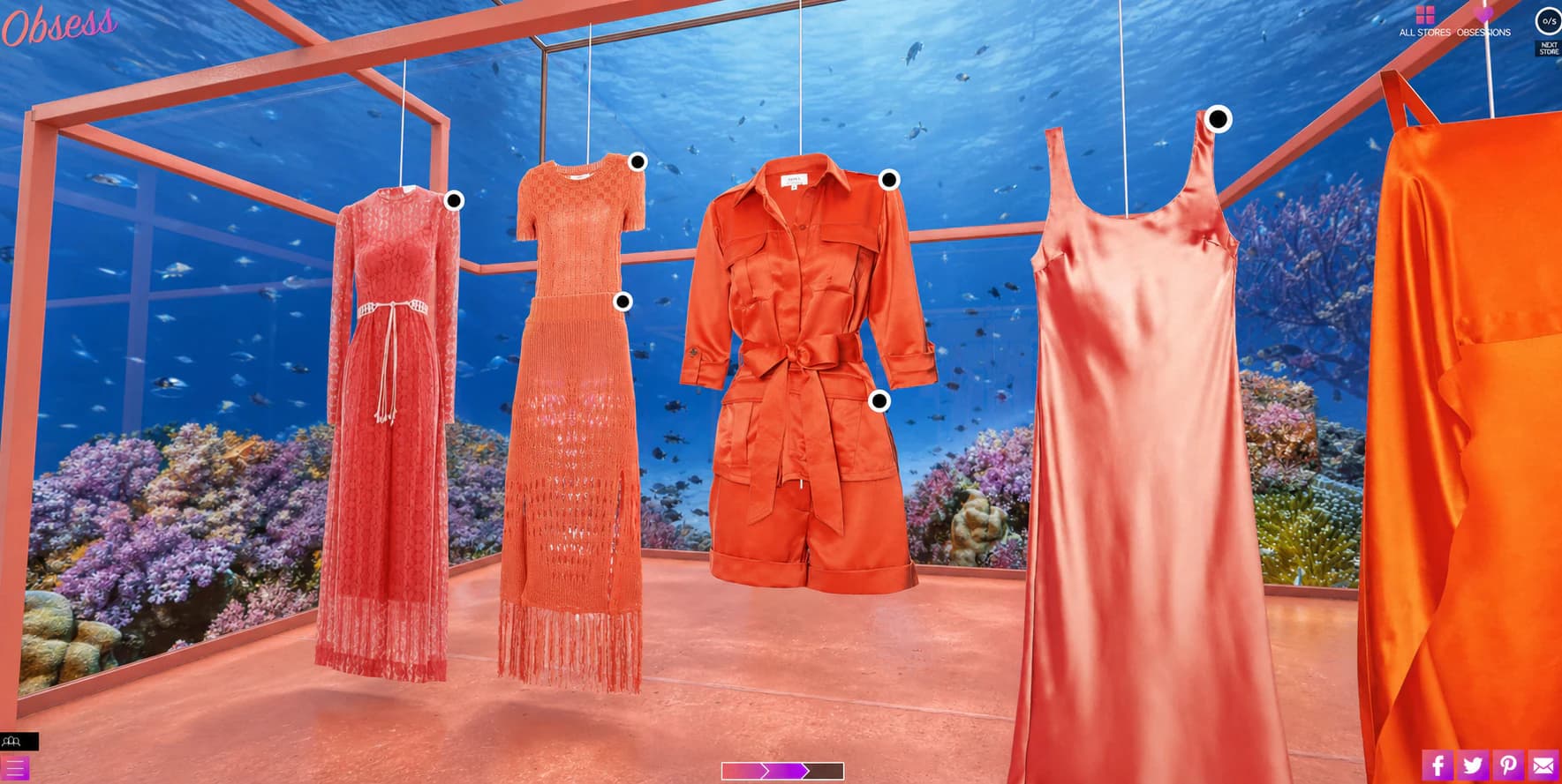 Coral-colored dresses displayed against the aquarium walls of an underwater virtual store.